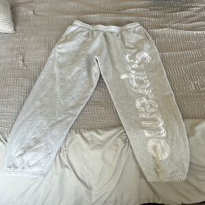SATIN APPLIQUÉ SWEATPANT
"FW23 - Ash Grey"